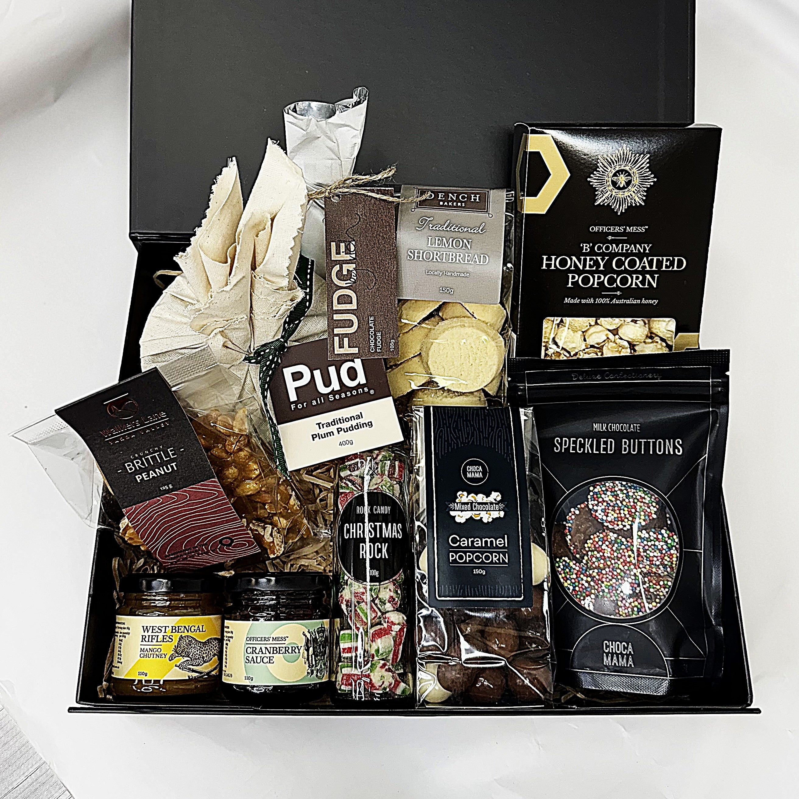 Gourmet Christmas gift basket with various snacks and treats