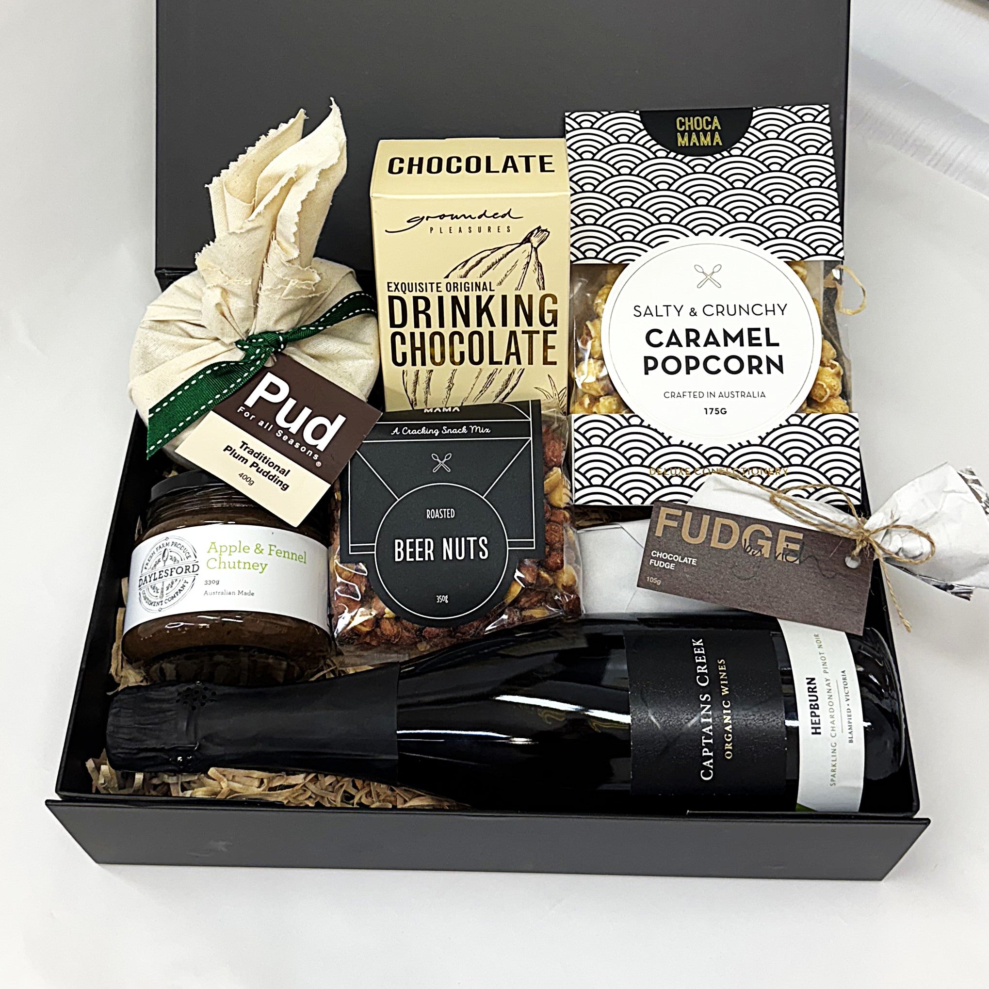 Deluxe Christmas Gift basket with chocolate, popcorn, beer nuts, and other treats 