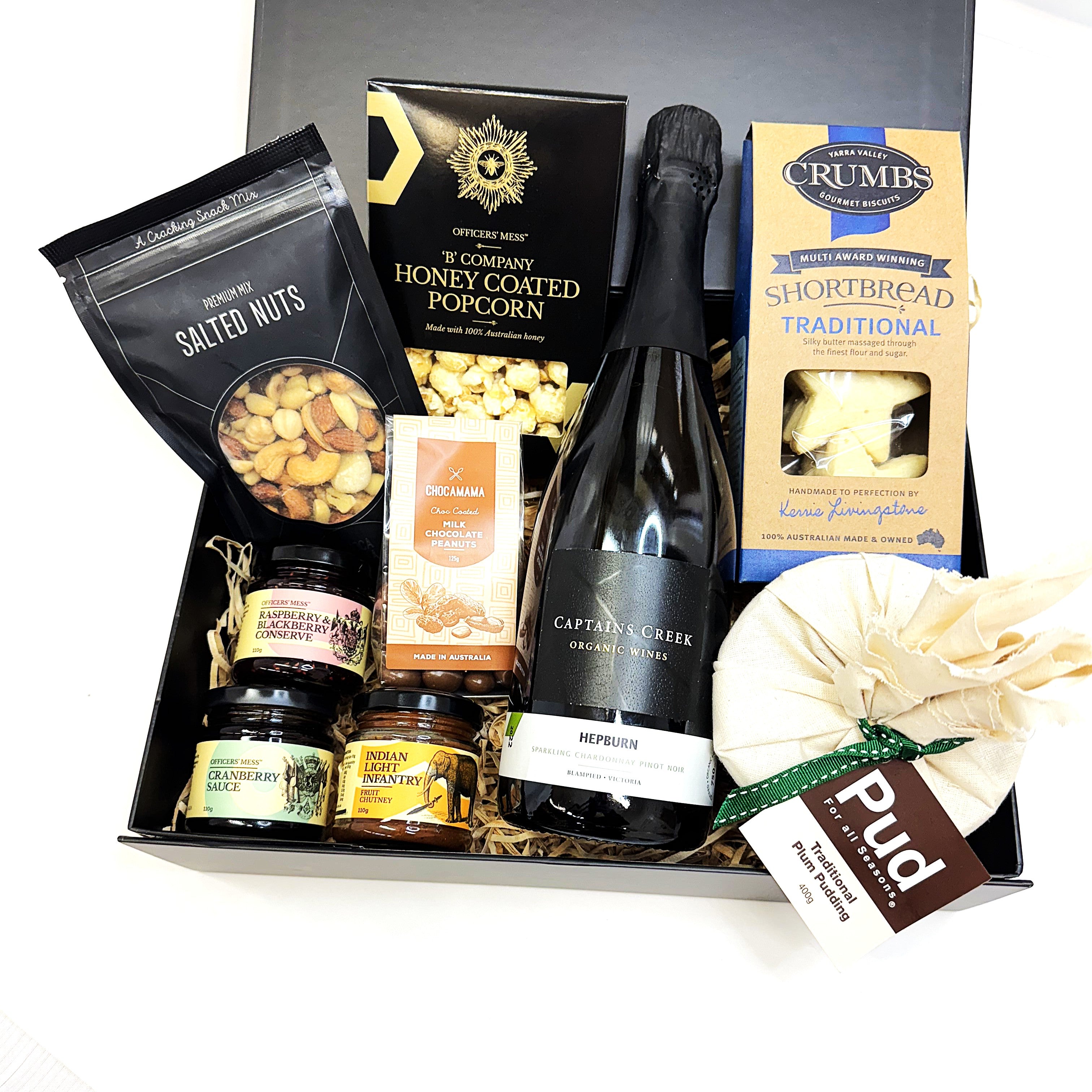 Gourmet Christmas gift basket with, Sparkling wine, snacks, and Christmas treats 