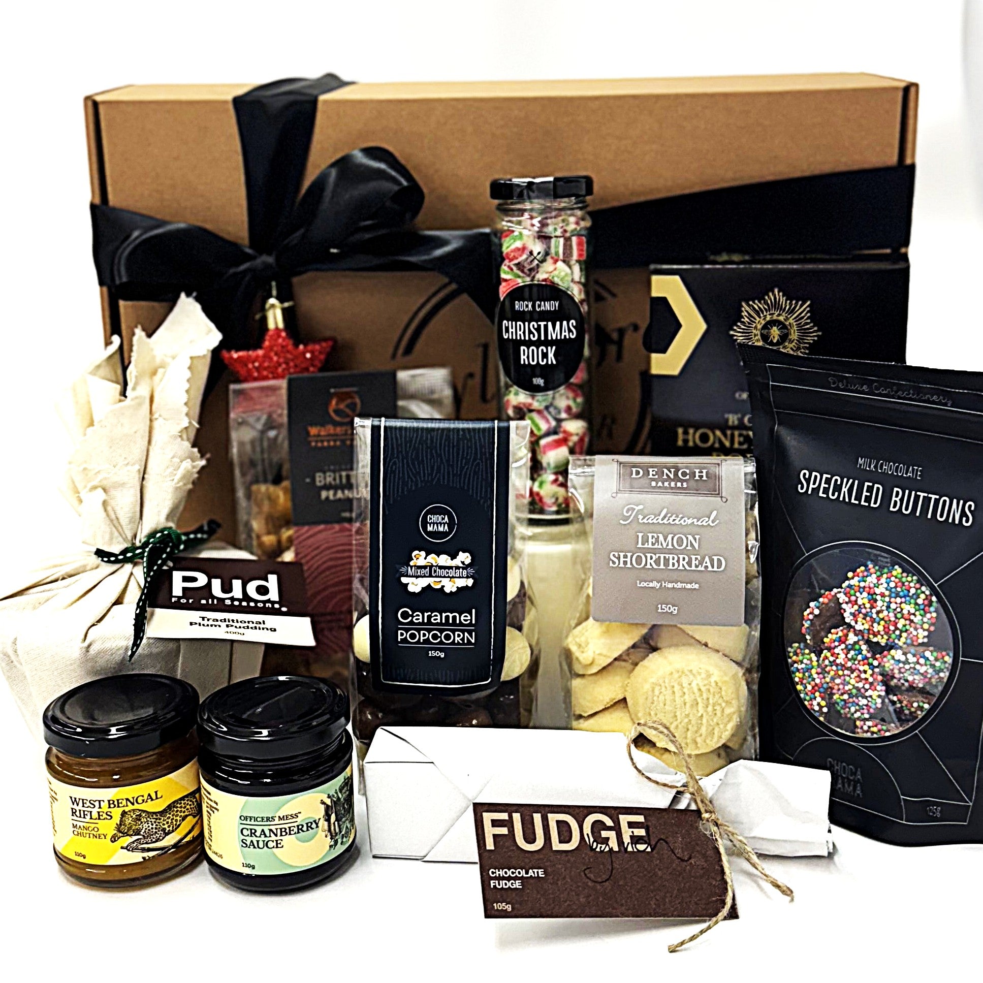 Gourmet Christmas gift basket with various treats including fudge, popcorn, and cookies 