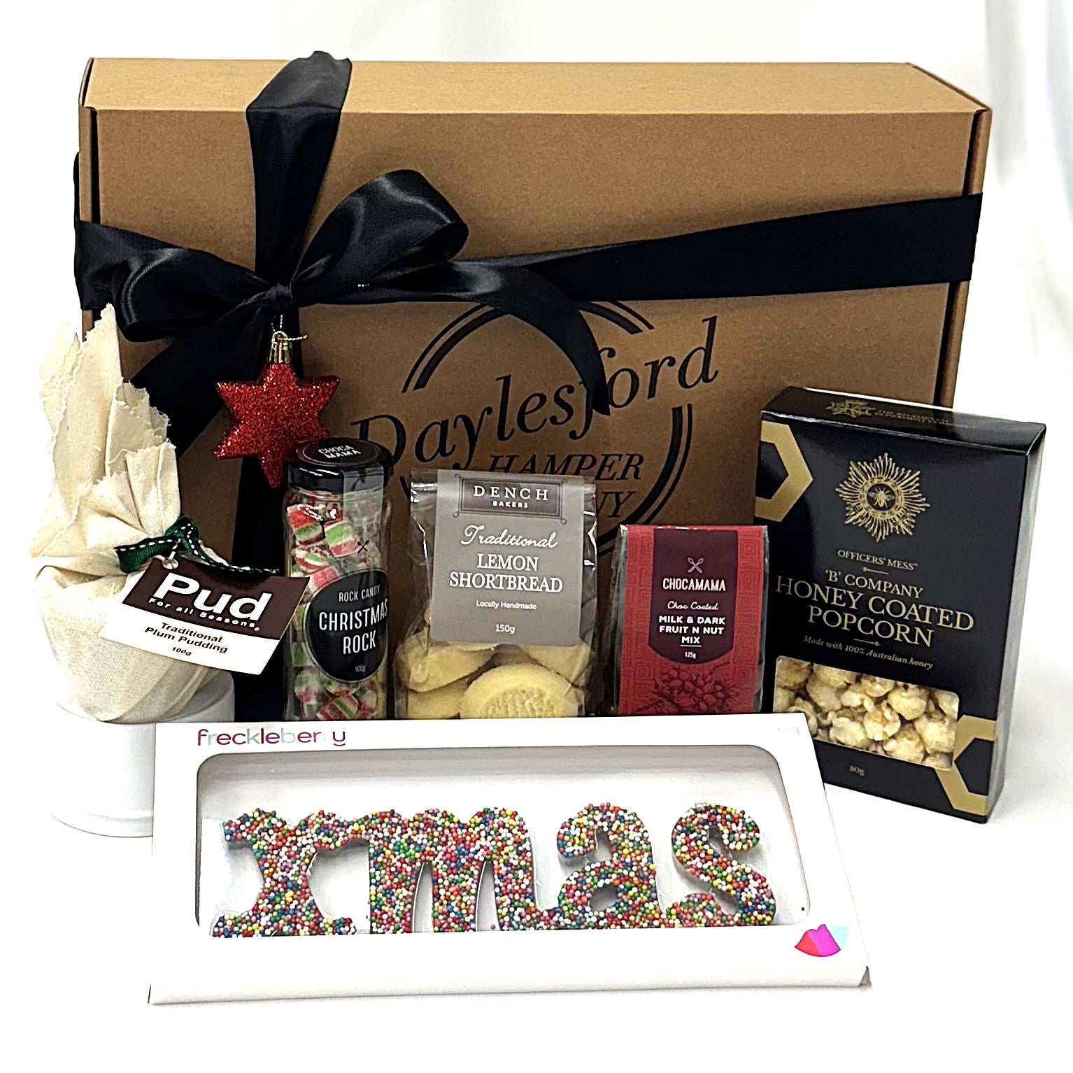 Christmas-themed gift box with various treats 