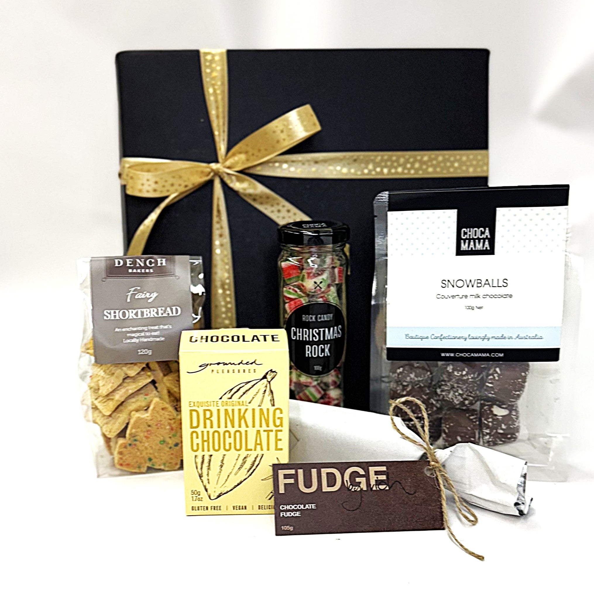 Assorted Christmas gourmet food items including chocolate, cookies, and fudge 