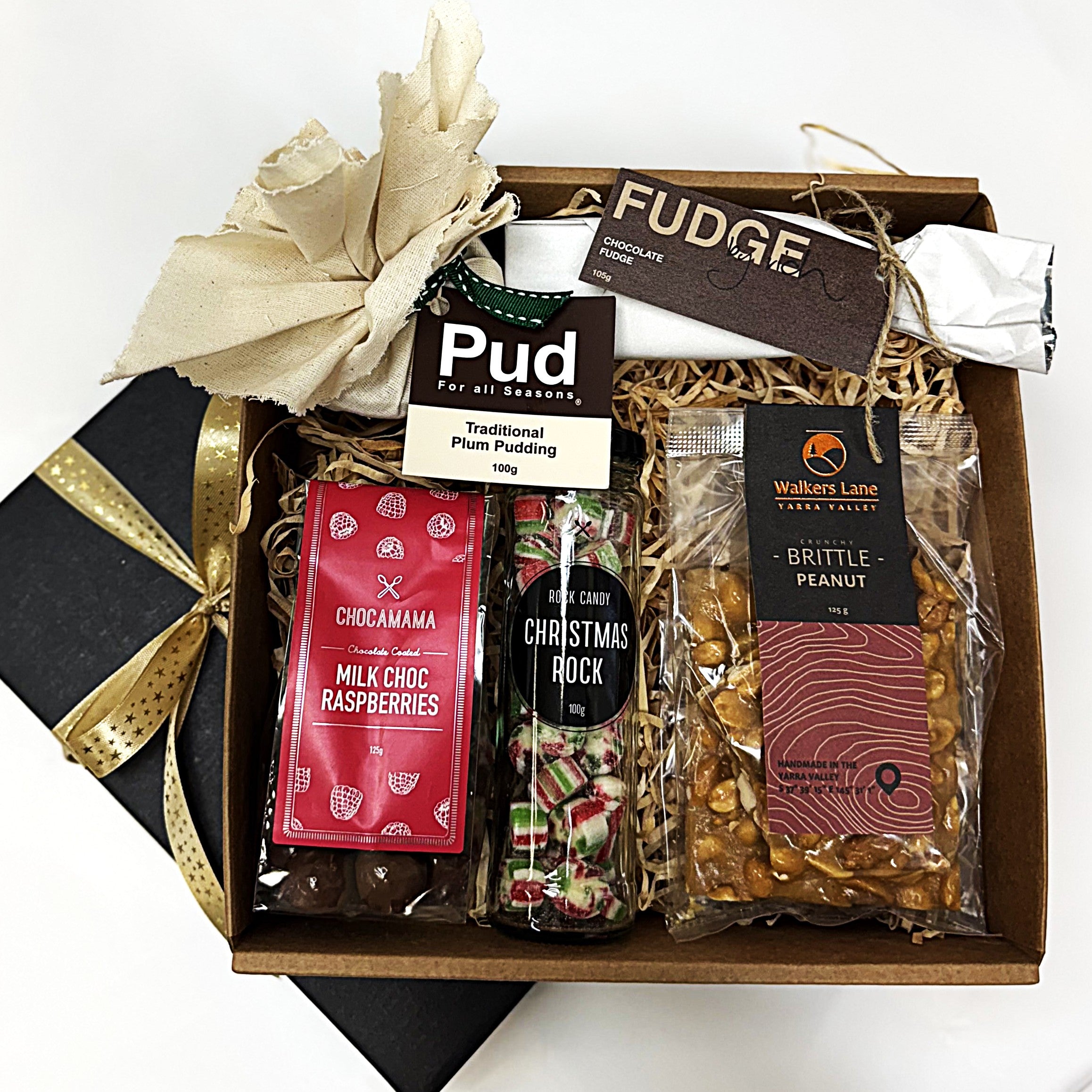 Christmas Gift box with assorted confectionery items including chocolate, pudding and candy